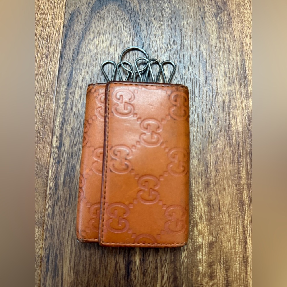 Gucci Guccissima leather wallet in orange.